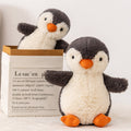 Peanut penguin stuffed plush toy next to gift box, soft emotional companion for kids and adults